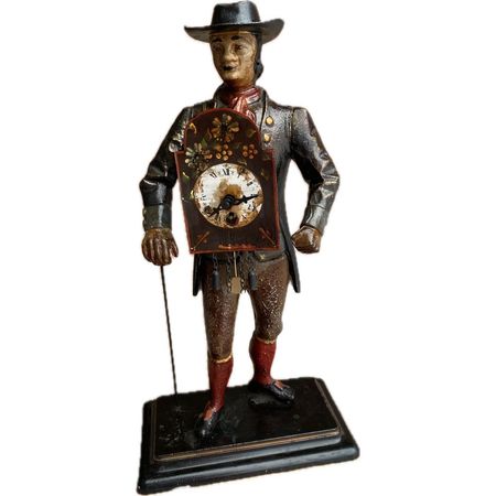 Figuralny zegar kominkowy „SPRZEDAWCA ZEGARÓW